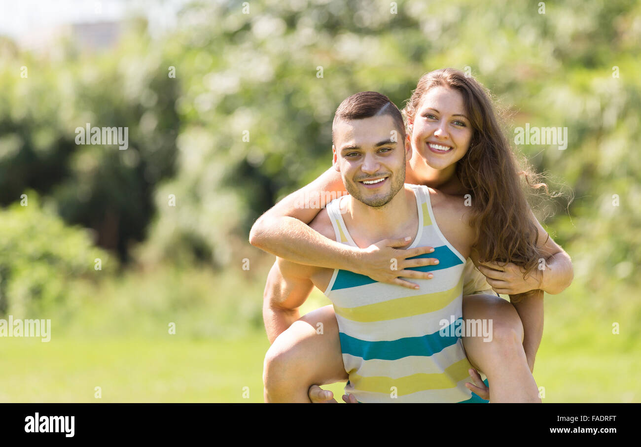 Happy loving man and woman laughing in a summer park Stock Photo - Alamy