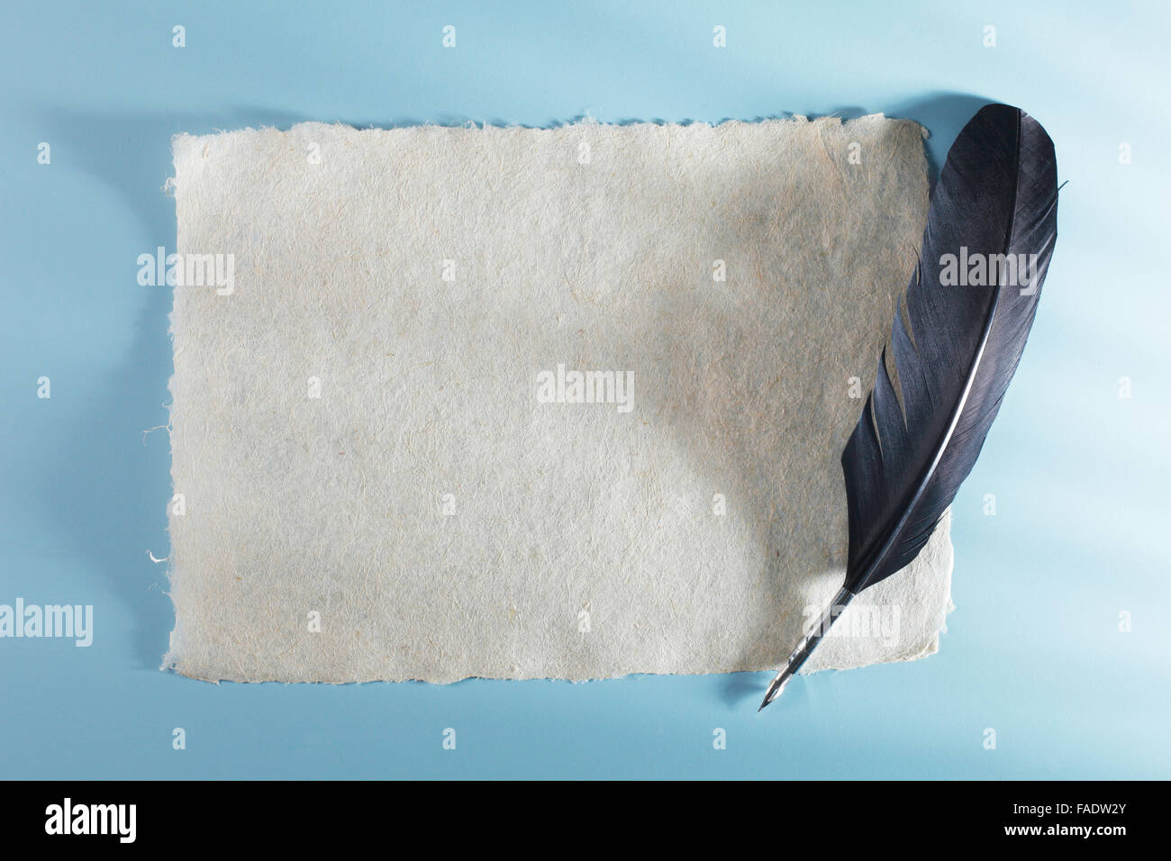 Quill pen on blank note pad Stock Photo Alamy