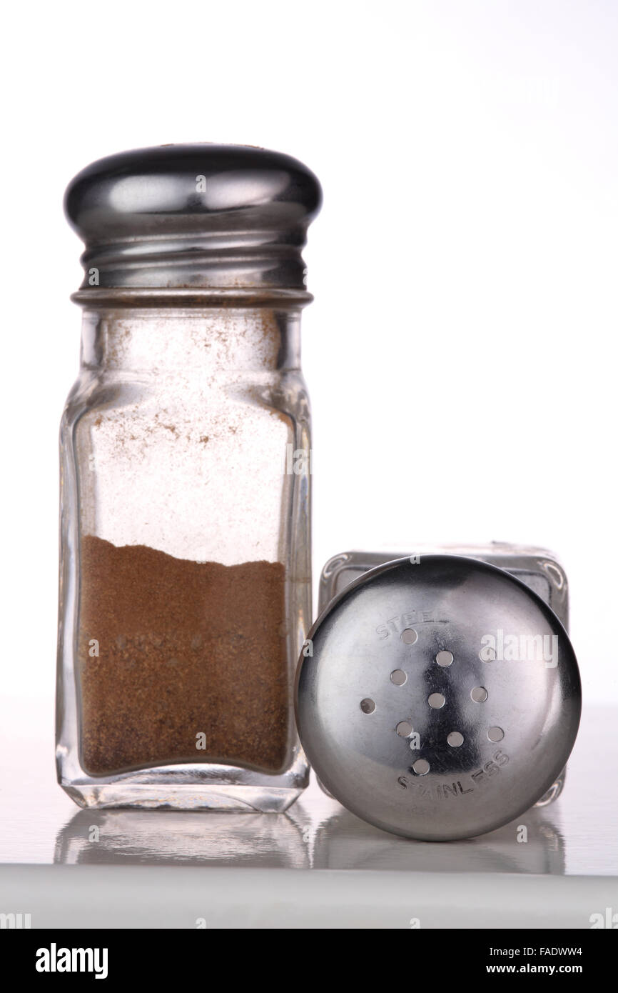 Pepper Shaker with Blurred Salt Shaker in Background Stock Photo - Image of  bottle, seasoning: 230452622