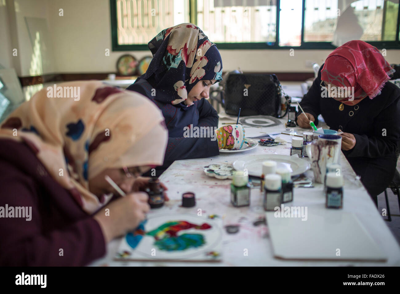 Gaza, Gaza City. 28th Dec, 2015. Disabled people work at the training center of the Irada Institution, in Gaza City, on Dec. 28, 2015. The center provides disabled people with 3-6 months of vocational training and temporary job opportunities so they can better cope with hardships in life. Credit:  Wissam Nassar/Xinhua/Alamy Live News Stock Photo