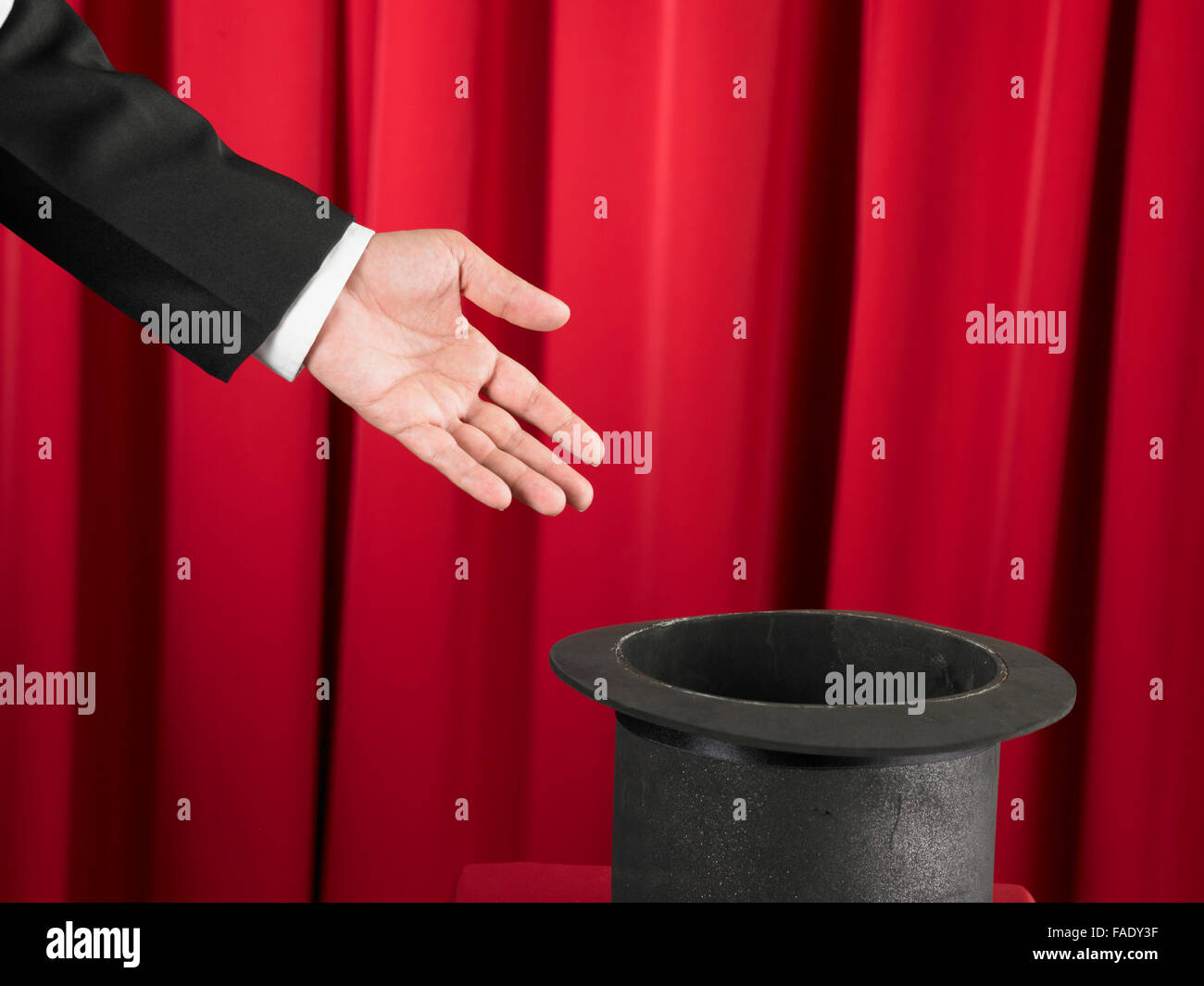 Magician Holding Showing The Top Hat Stock Photo - Alamy