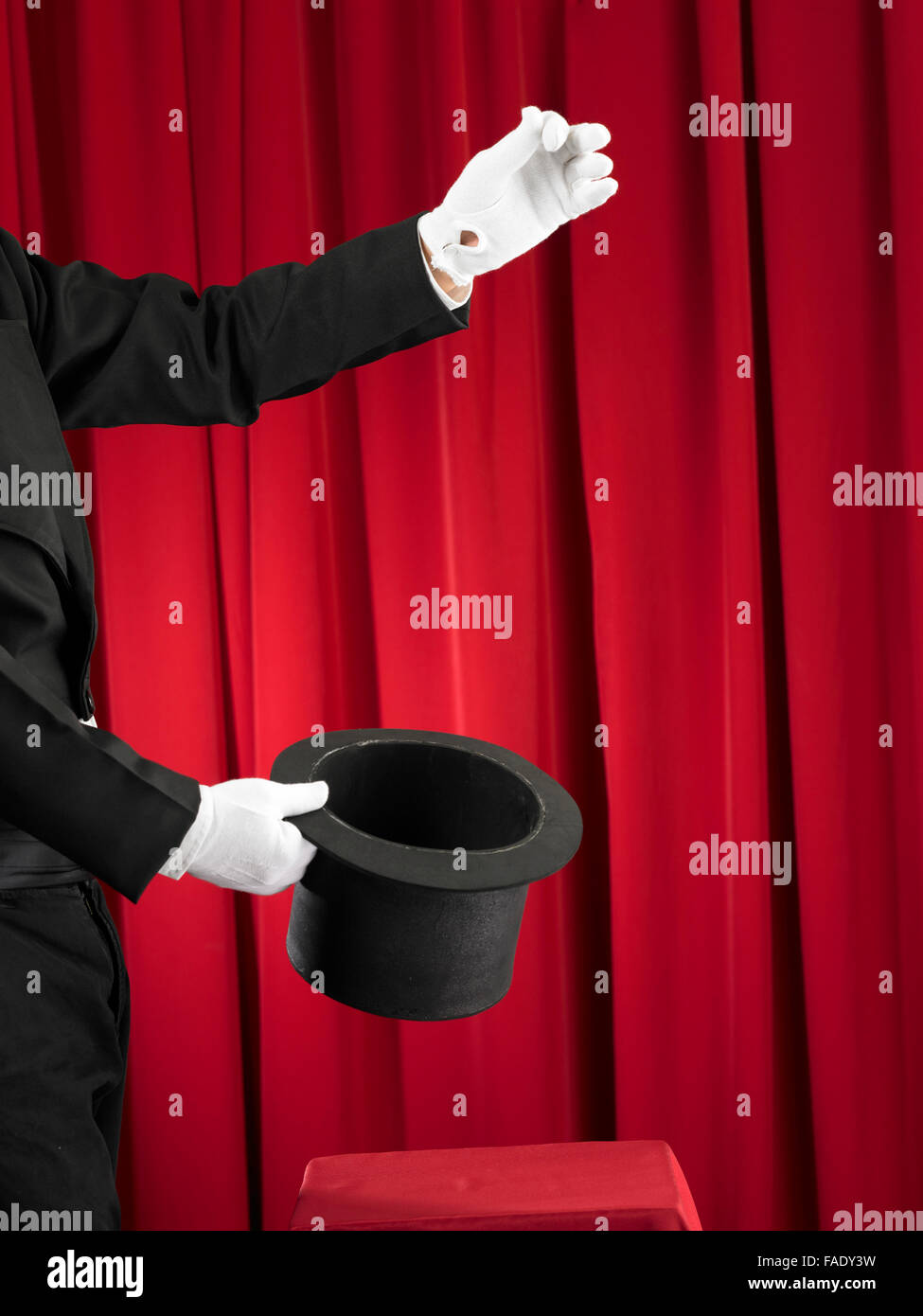 Magician Holding A Top Hat Stock Photo - Alamy