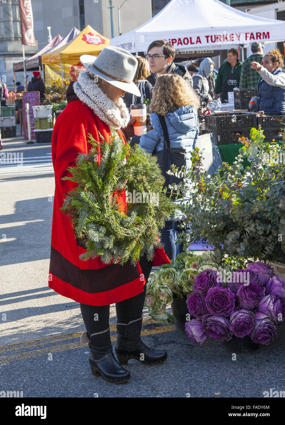 Woman buying a Christmas Wreath at the Grand Army Plaza Farmers Market in Park Slope, Brooklyn, NY Stock Photo