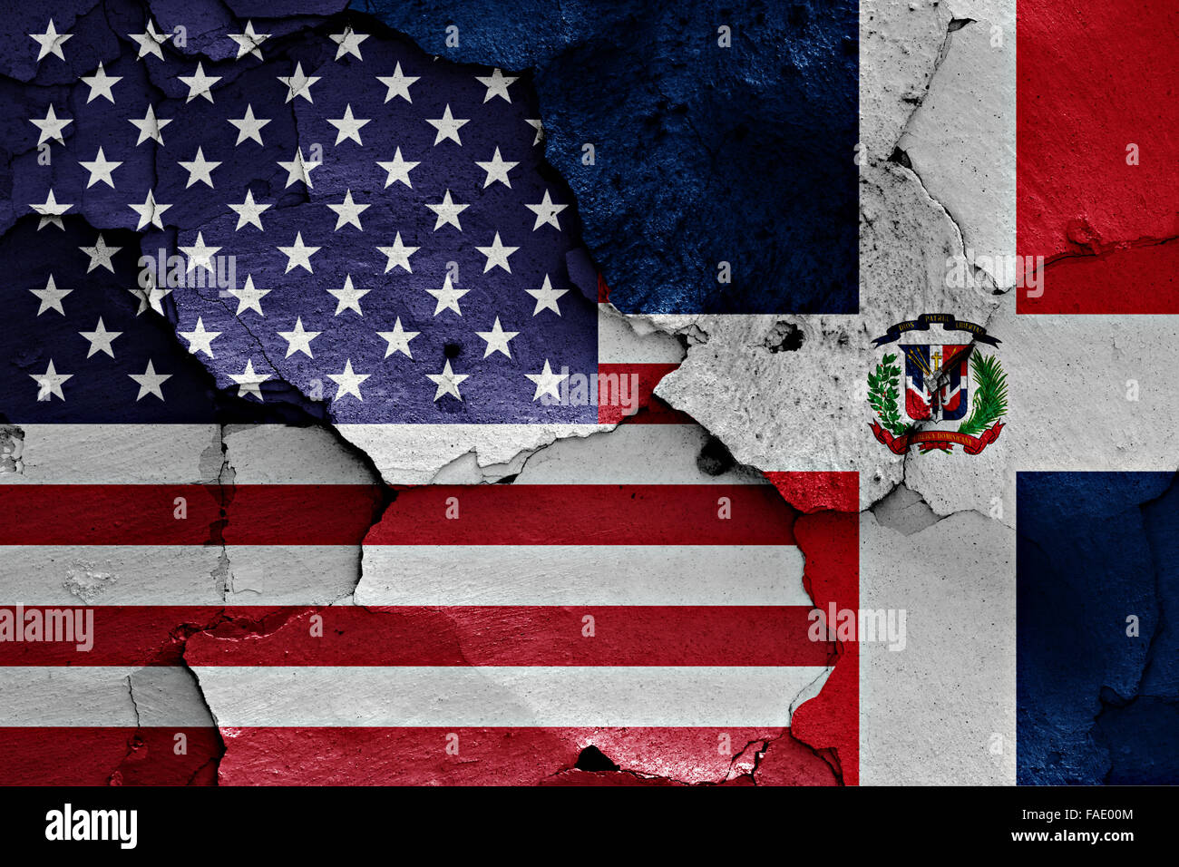flags of USA and Dominican Republic painted on cracked wall Stock Photo