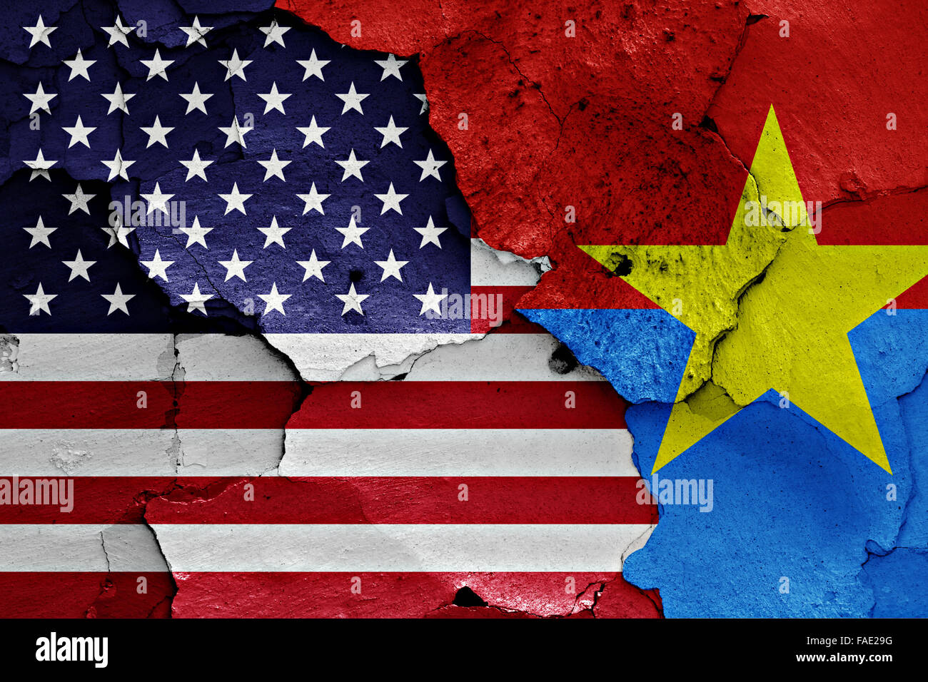 flags of USA and Viet Cong painted on cracked wall Stock Photo