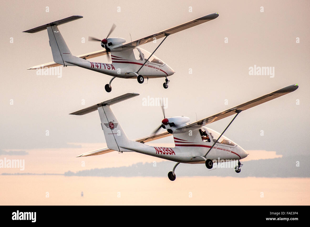 Aerial view of two planes at sunset during a formation flight Stock Photo