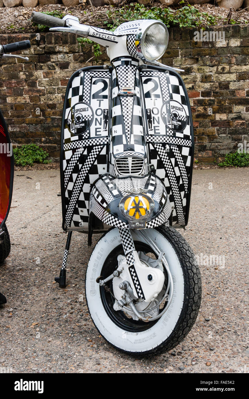 Front of Lambretta motor scooter, Innocenti, decorated totally in two tone  from the cult group 'the Specials' pop group stickers and logos Stock Photo  - Alamy