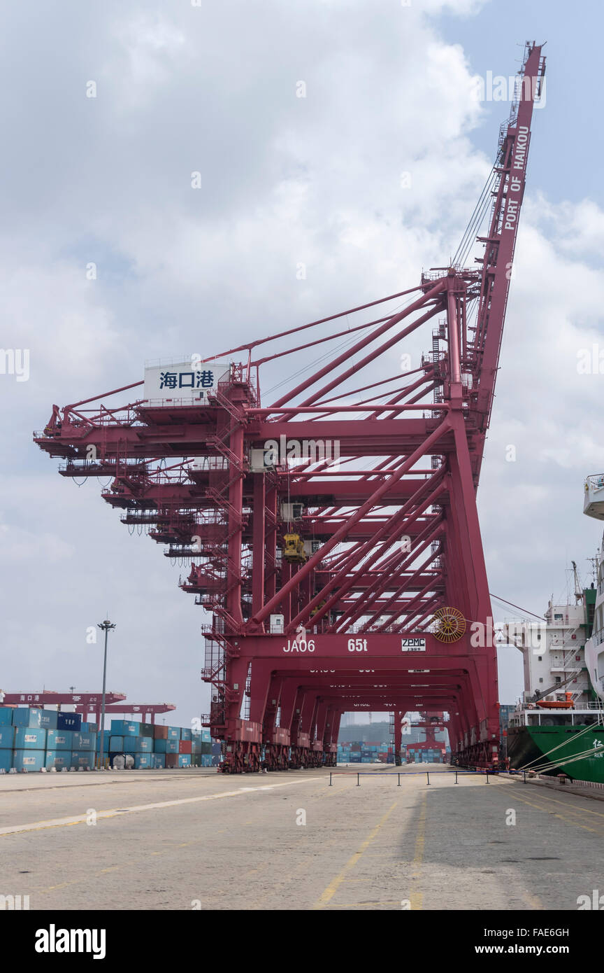 Container terminal and a row of cranes at the port of Haikou on Hainan island, south China. Stock Photo