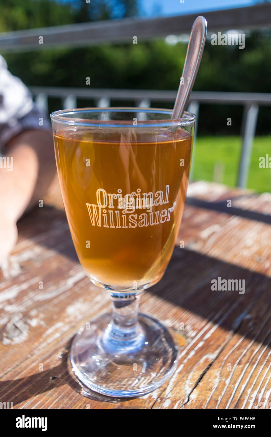 Kaffee Schnaps: thin coffee mixed with a considerable amount of liquor ('Schnaps'), a traditional Swiss alcoholic beverage served in a glass. Stock Photo