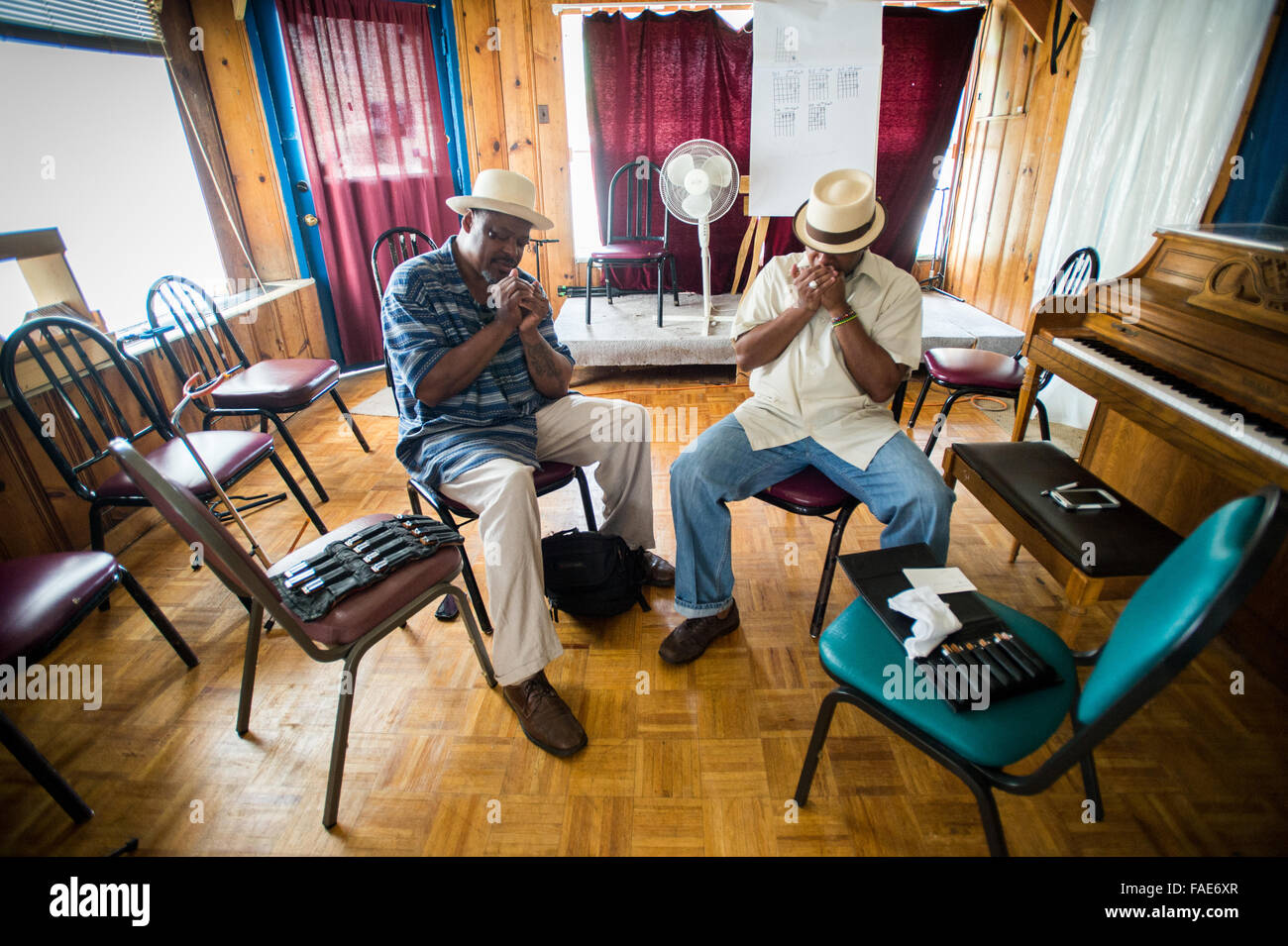 Men playing the blues harmonica. Stock Photo