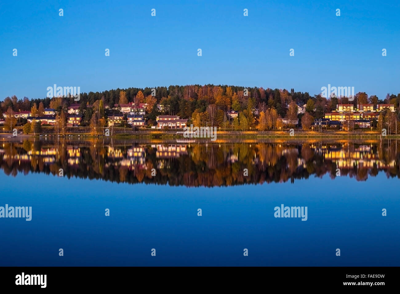 Amost perfect reflection at Finnish lake in blue hour Stock Photo