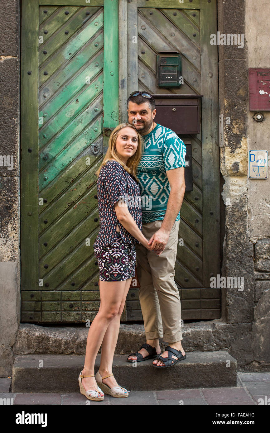 Couple in love near the door of an old house. Stock Photo