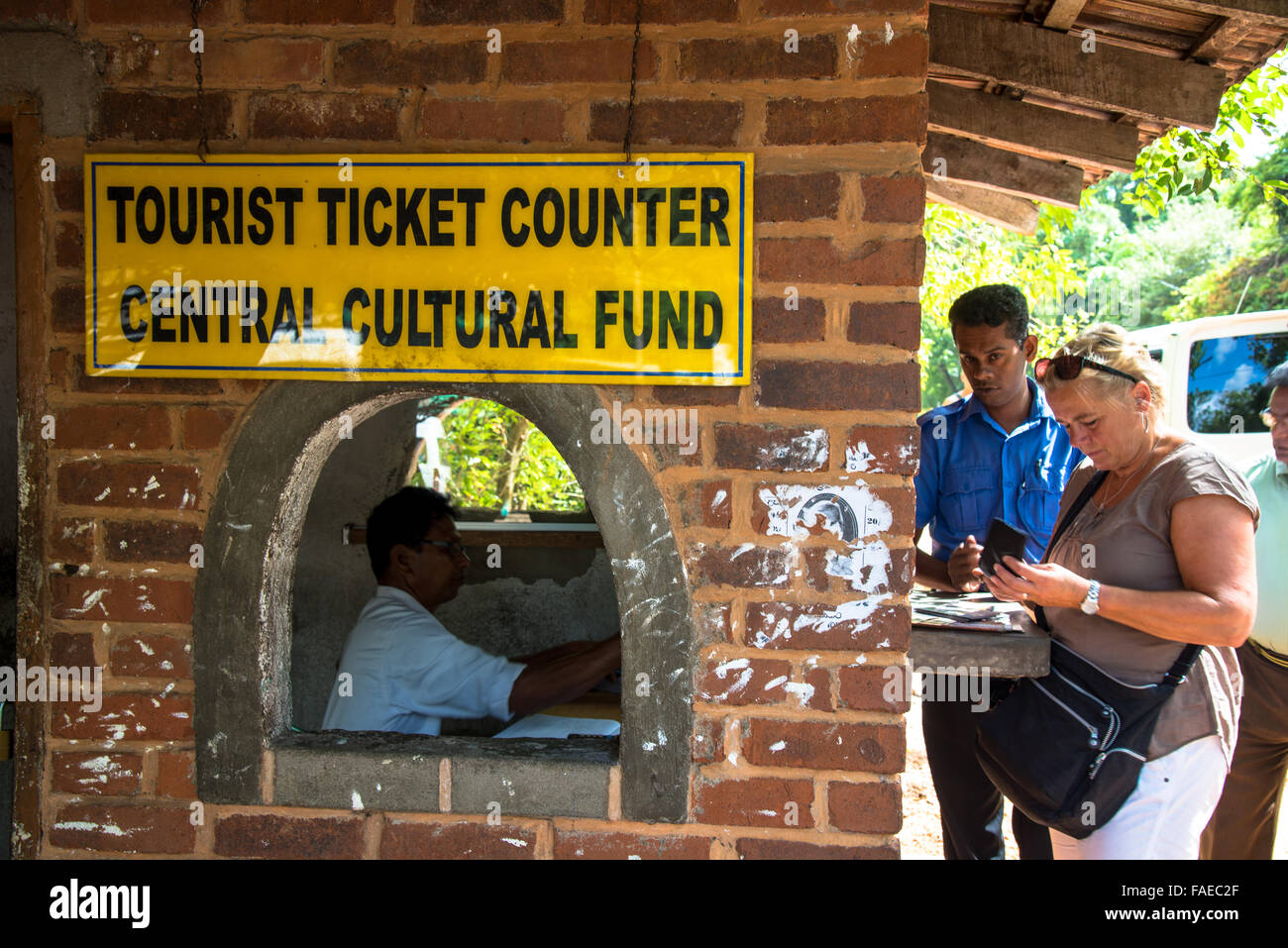 tourist buys ticket at counter in anaradhapura sri lanka Stock Photo