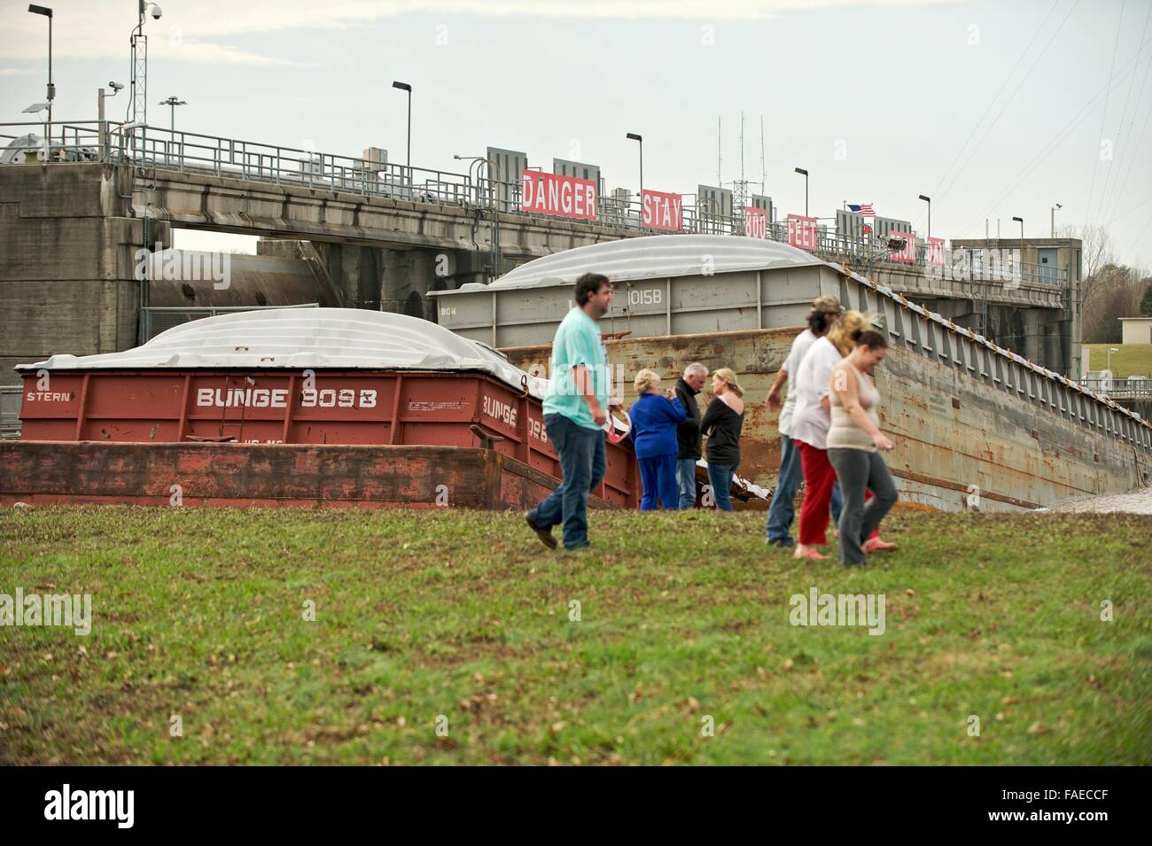 Columbus, Missouri, USA. 28th Dec, 2015. Onlookers braved the high winds to come and see the mess at the Stennis Lock and Dam in Columbus, Ms. Two barges broke loose during the storms in the area and lodged up against the dam. Credit:  Tim Thompson/Alamy Live News Stock Photo