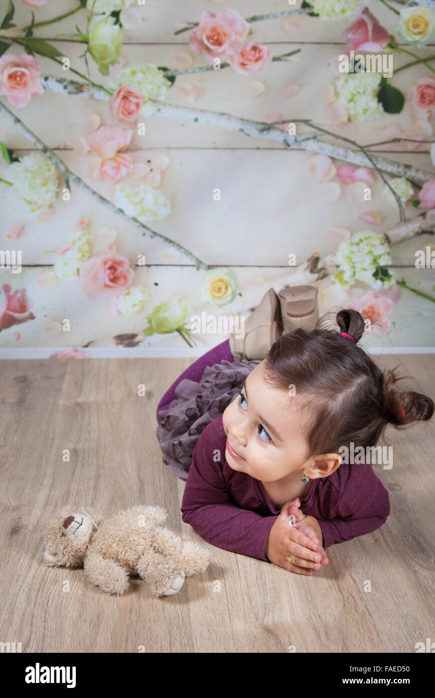 Portrait of 1 and a half gorgeous baby girl indoor. Stock Photo