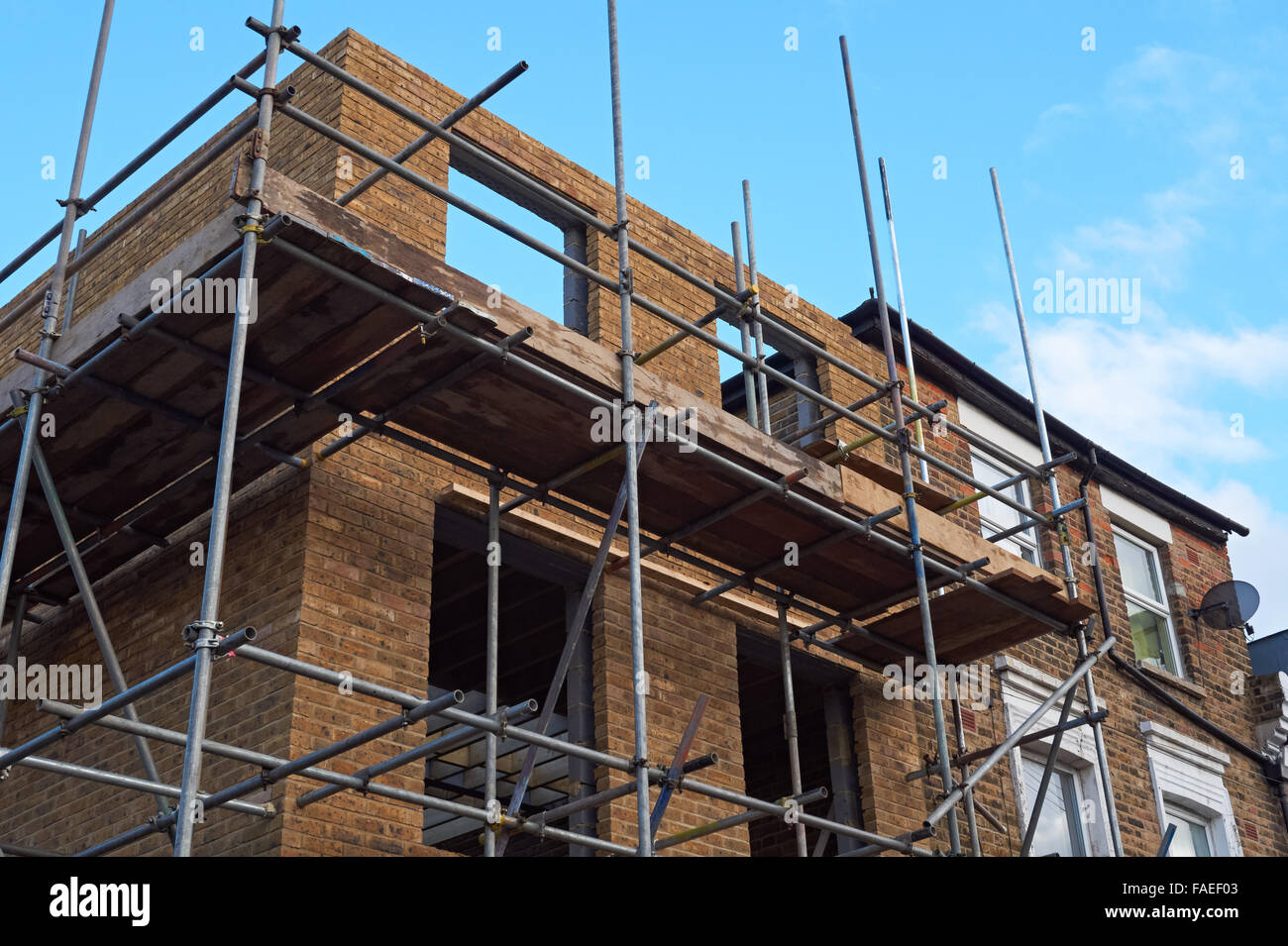 Construction of new brick terraced house, London England United Kingdom UK Stock Photo