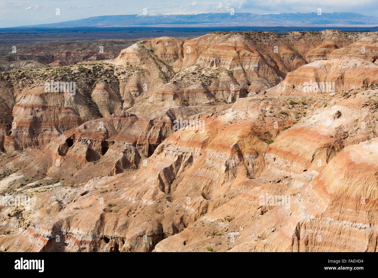 The Bighorn Mountains rise behind the badlands of the Bighorn Basin in north-central Wyoming. Stock Photo