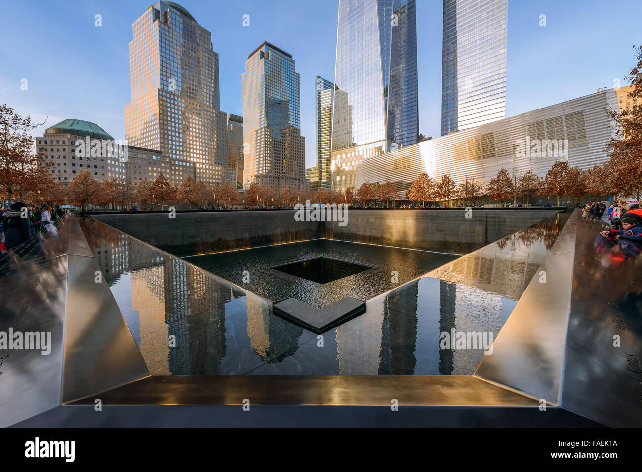 NEW YORK - USA - DECEMBER 20, 2015: People near freedom tower and 9/11 memorial Stock Photo