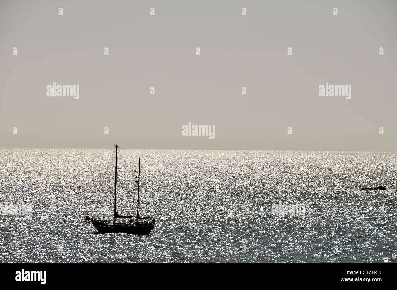 Silhouette Boat in the Ocean Stock Photo - Alamy