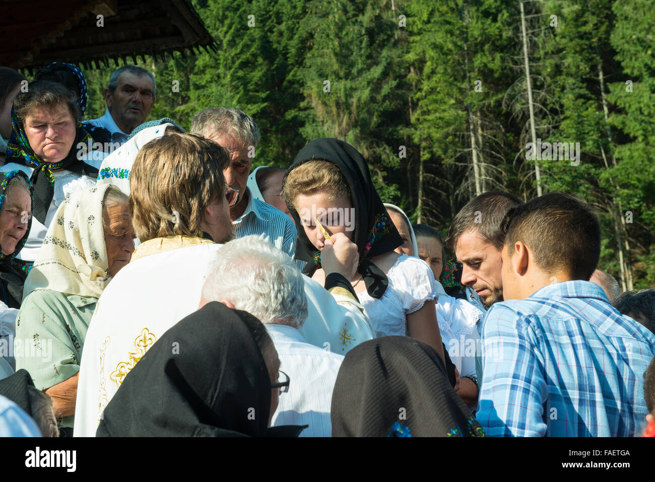 priest with faithful during a church function outdoors Stock Photo