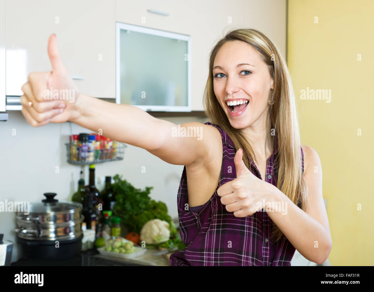 Happy young woman thumbs up hi-res stock photography and images - Alamy