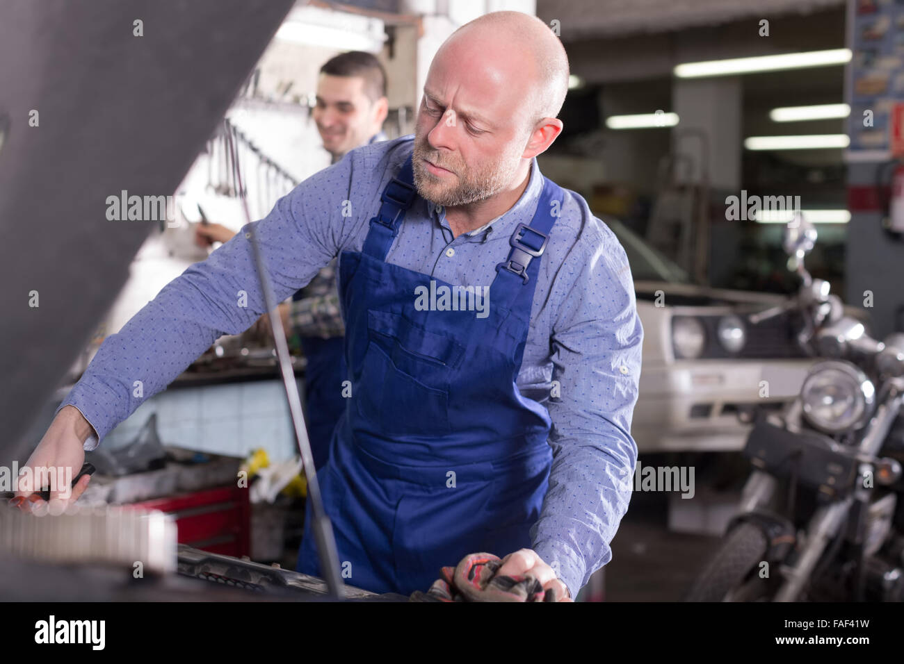 american people working at carshop Stock Photo