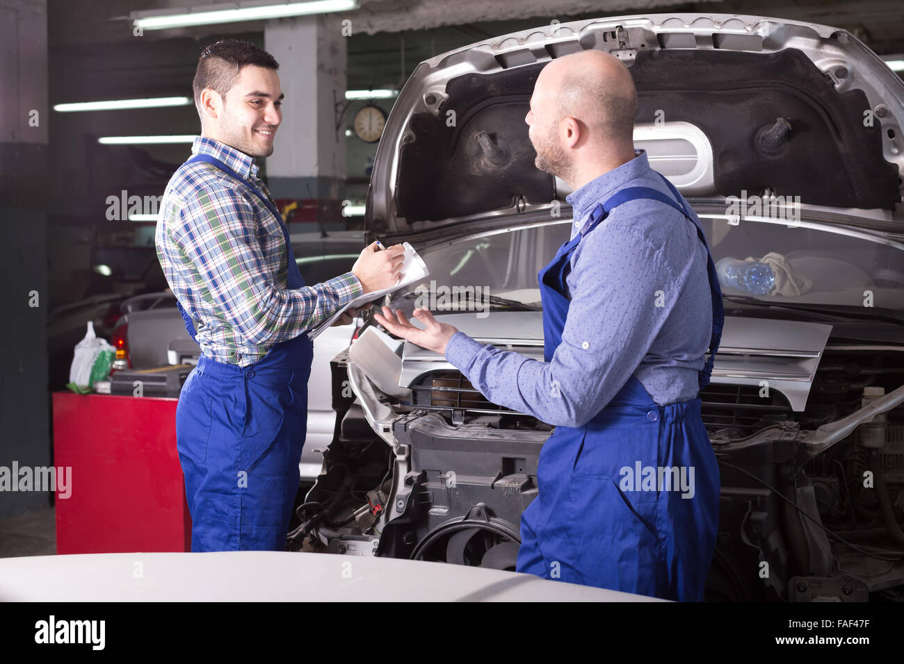Car Repair Insurance >> Happy Insurance Agent And Professional Mechanic Indoors In Car Repair Insurance >> Happy Insurance Agent And Professional Mechanic Indoors In