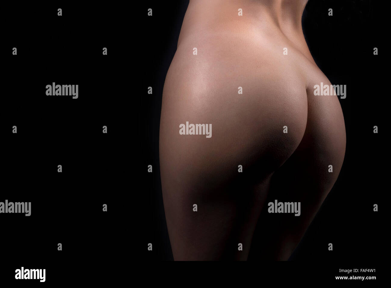 Closeup Of A Sexy Nude Woman Ass Over Black Background Stock Photo - Alamy