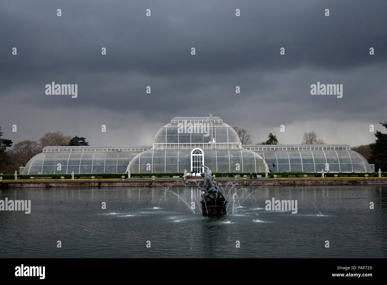 The Victorian Palm House and lake, Kew Gardens, London UK Stock Photo