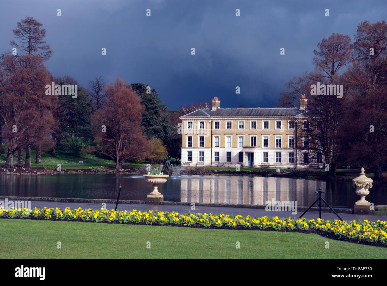 The Kew Museum and lake on a stormy day Kew Gardens London England UK Stock Photo