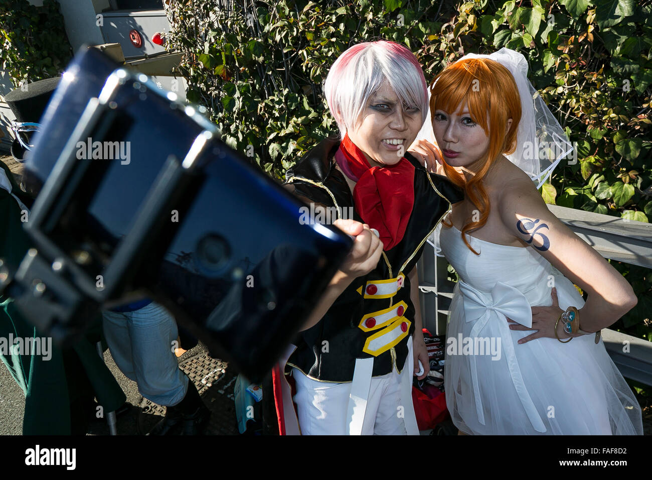 Tokyo, Japan. 29th Dec, 2015. Cosplayers pose for a selfie during the ...