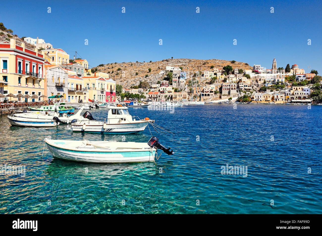 Fishing boats at the port of Symi island, Greece Stock Photo - Alamy