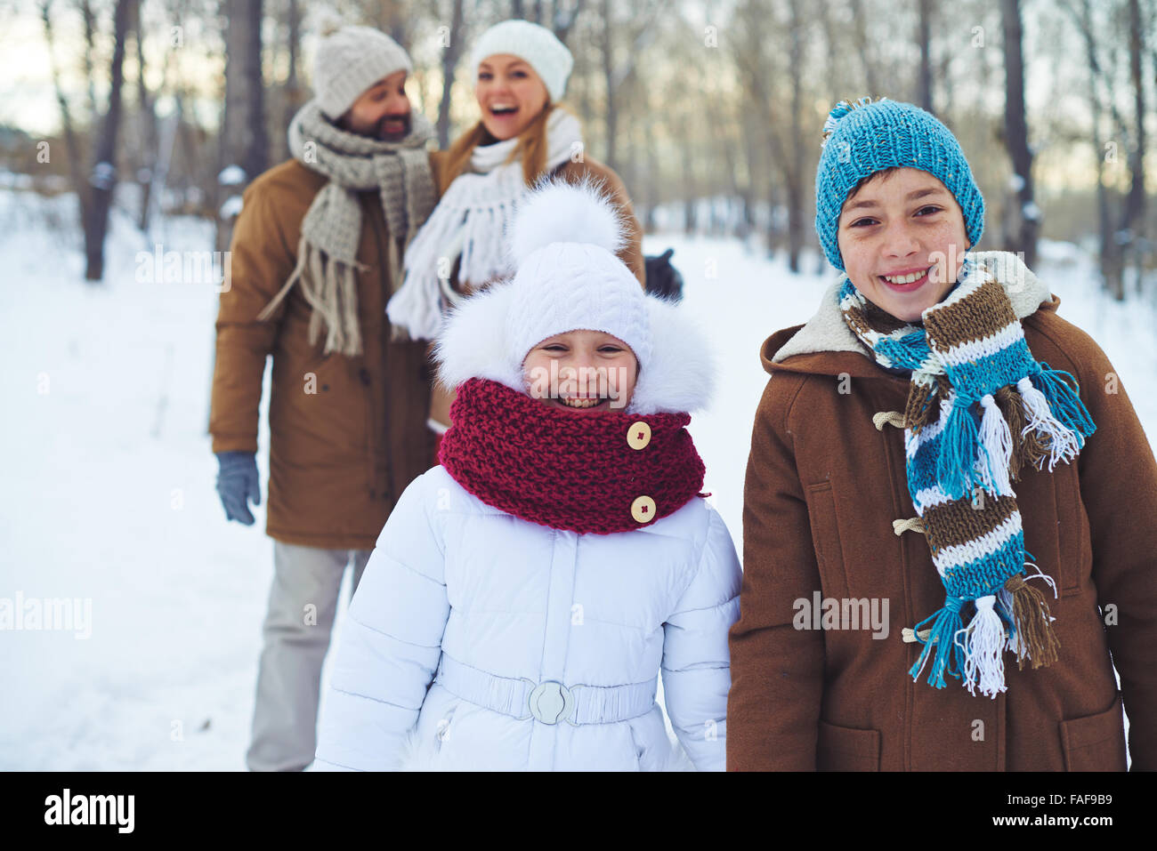 Children having fun outdoors with their parents Stock Photo - Alamy
