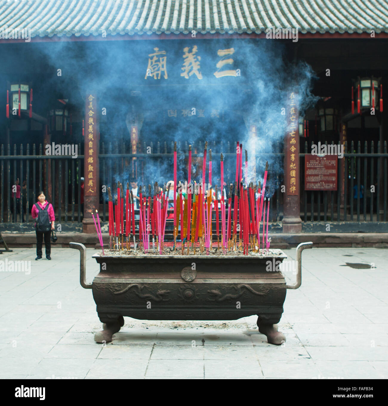 Chinese people burning incense sticks. China Stock Photo