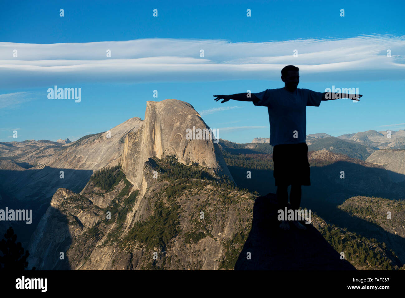 Yosemite National Park,striking a pose across from Half Dome at Glacier Point Stock Photo