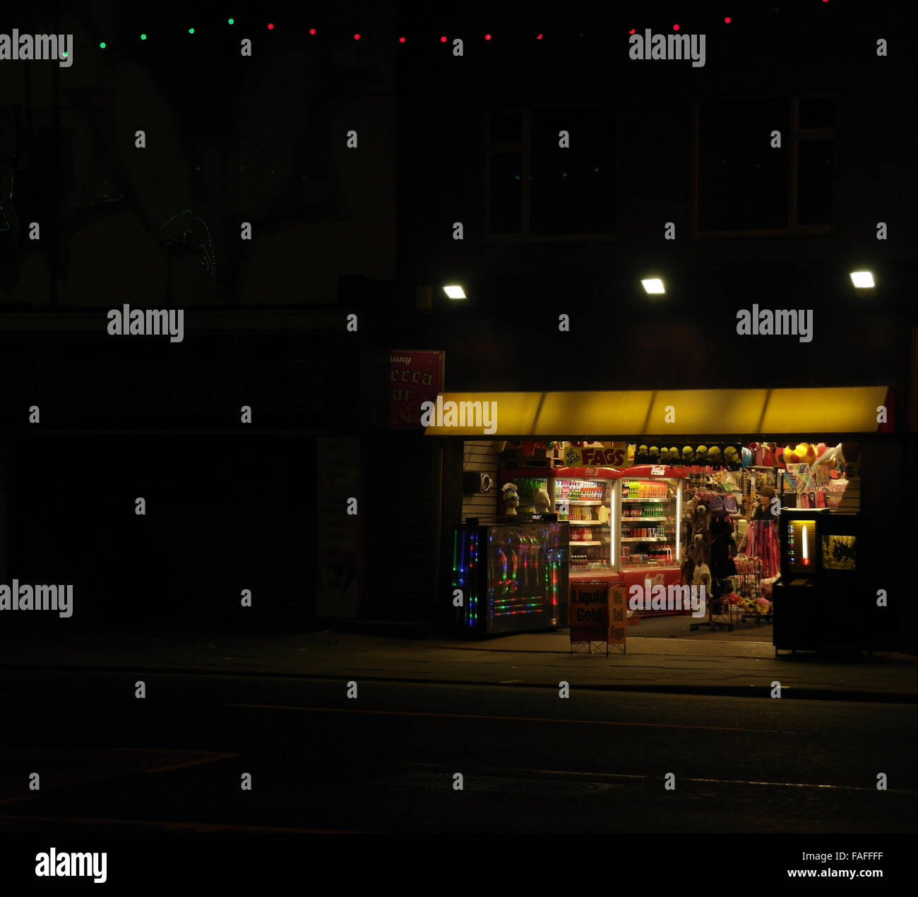 Night view electric lights shop selling novelties, toys, balls