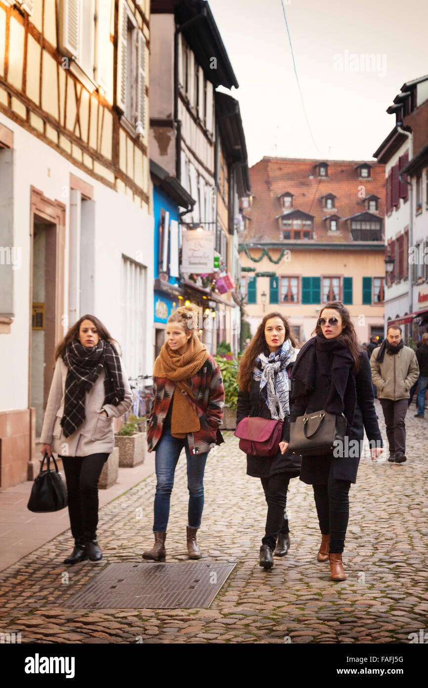 Strasbourg people; - women walking on the cobbled streets, Petite France, Strasbourg Old Town, Strasbourg, Alsace, France Europe Stock Photo