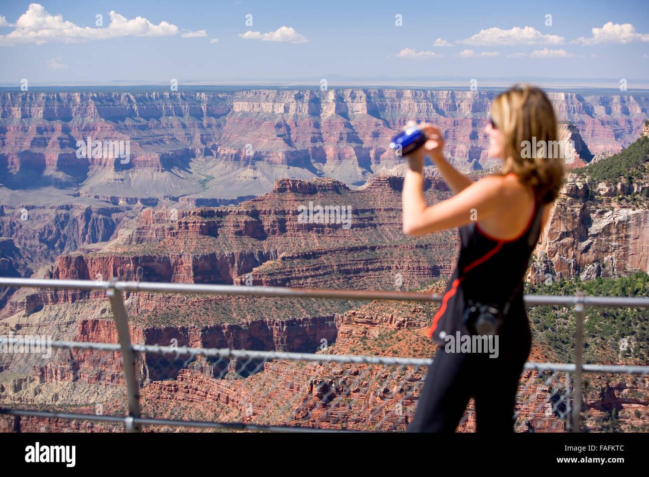 Woman taking photographs of the Grand Canyon. Arizona. USA Stock Photo