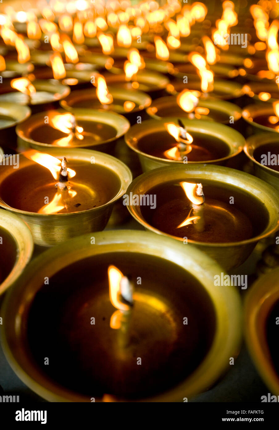 Oil lamps in Buddhist temple at Leshan  China Stock Photo