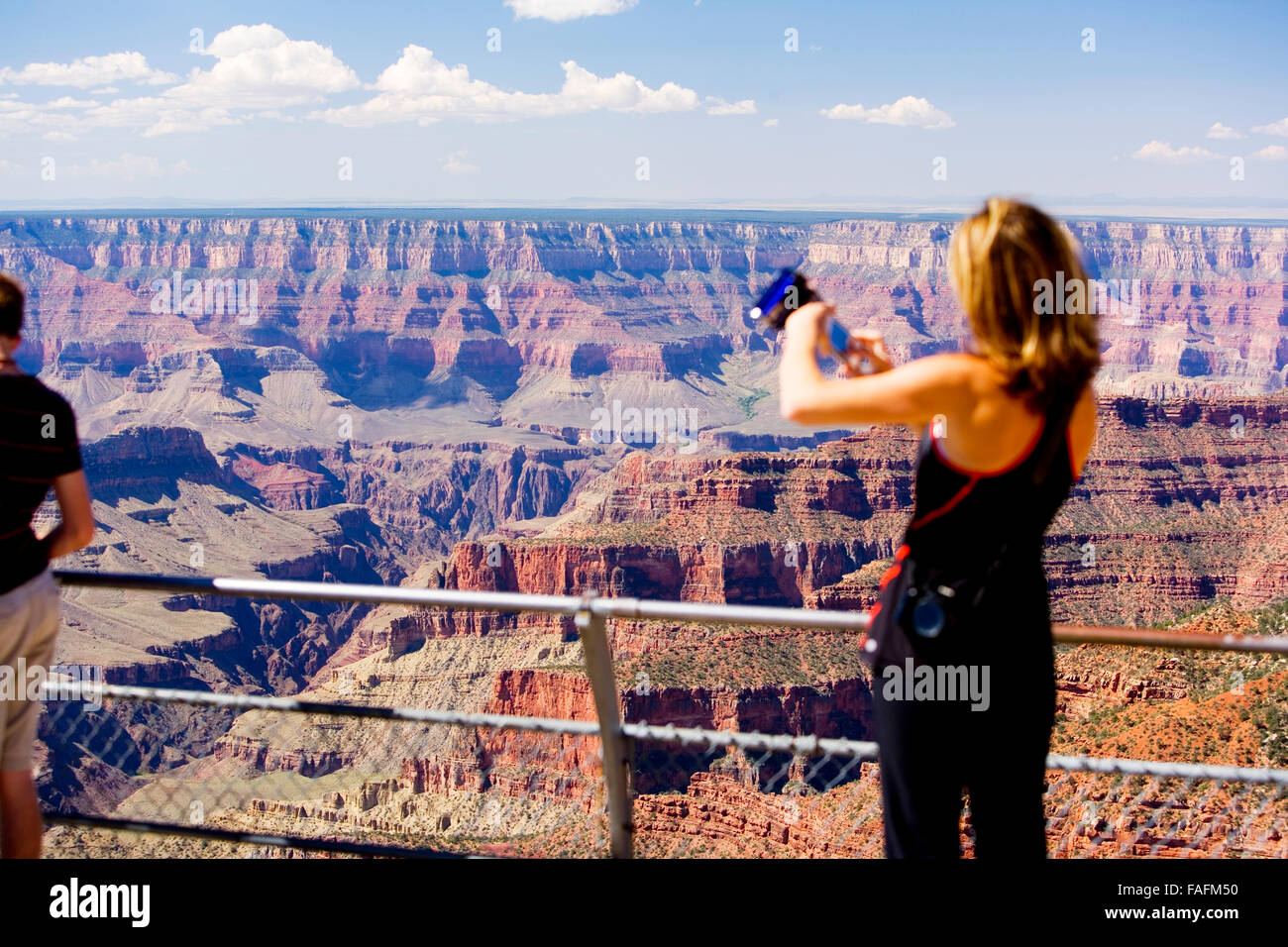 Woman taking photographs of Grand Canyon, Arizona, USA Stock Photo