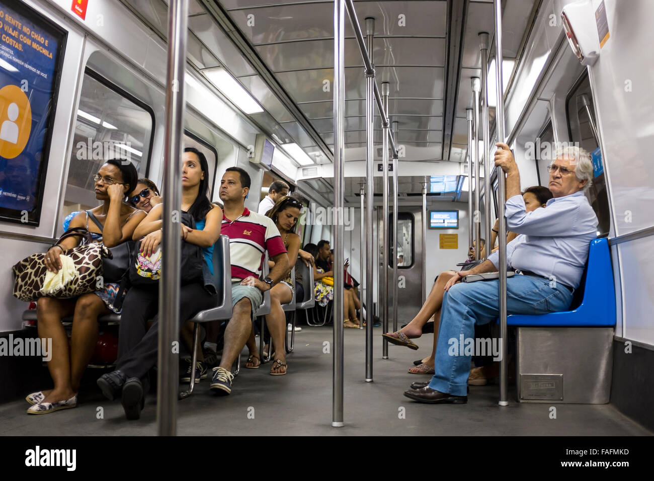 RIO DE JANEIRO, BRAZIL - OCTOBER 22, 2015: Brazilians ride a relatively empty car on the metro. Stock Photo