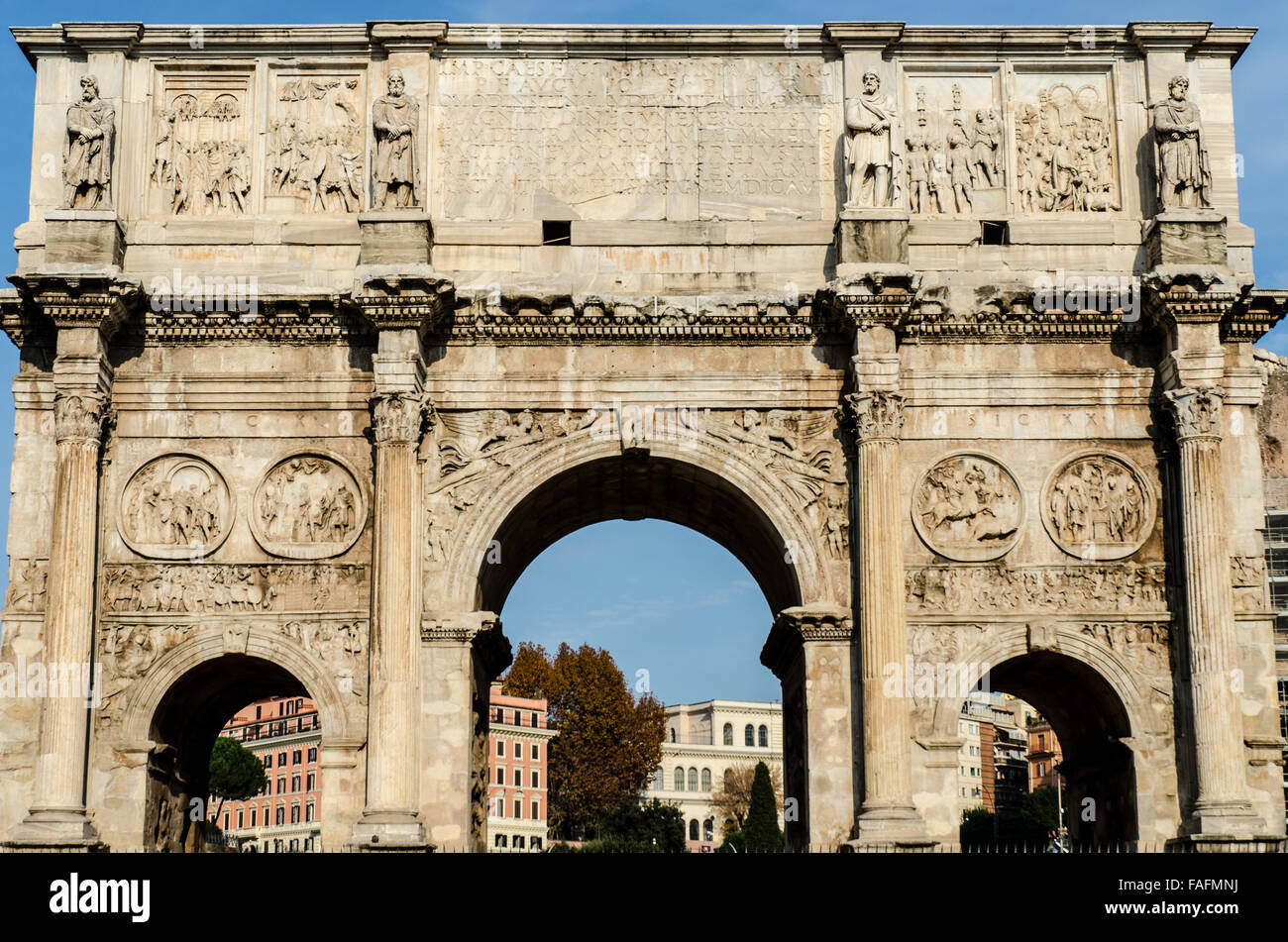 The Arch of Constantine is a triumphal arch in Rome, situated between the Colosseum and the Palatine Hill. Stock Photo