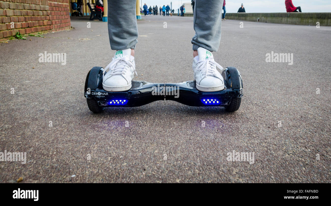 Person Riding a HoverBoard on a Public Footpath, They are now banned in all public places in the United Kingdom Stock Photo