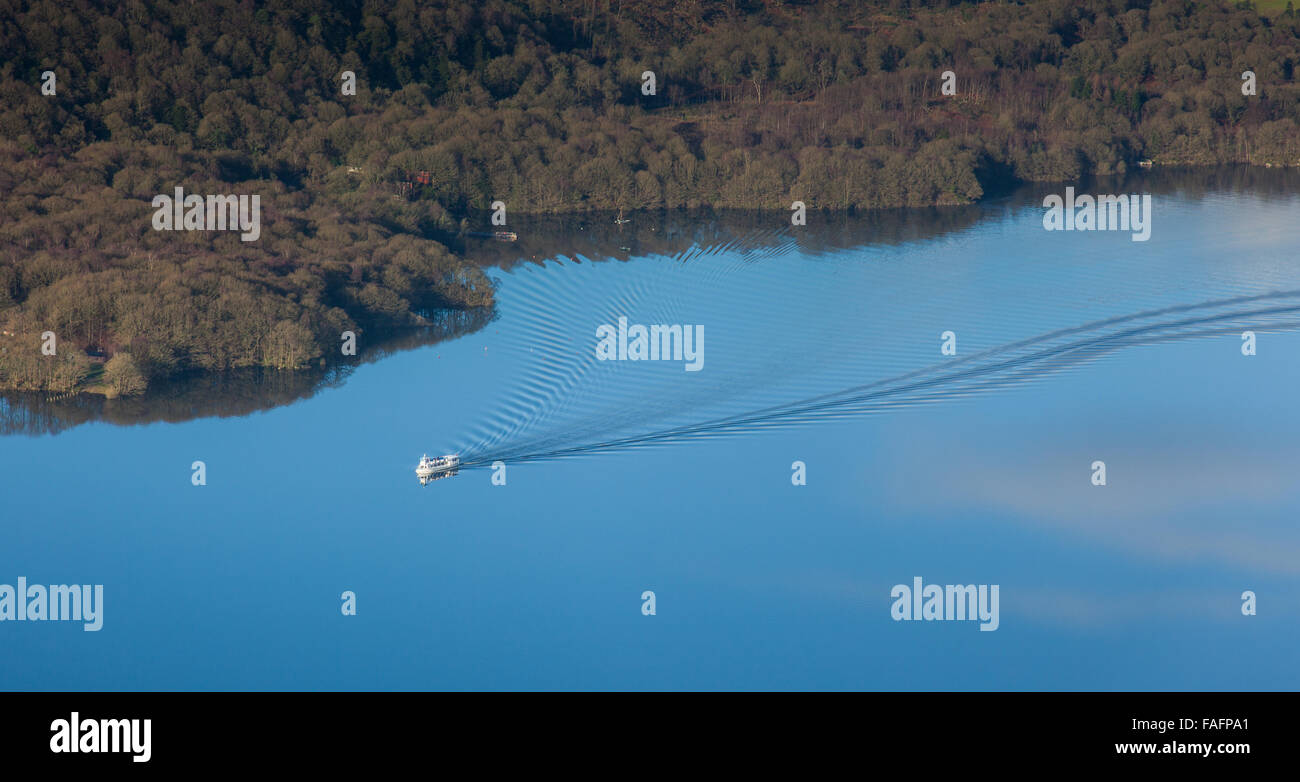 A pleasure boat cruises along Windermere, as seen from Gummer's How