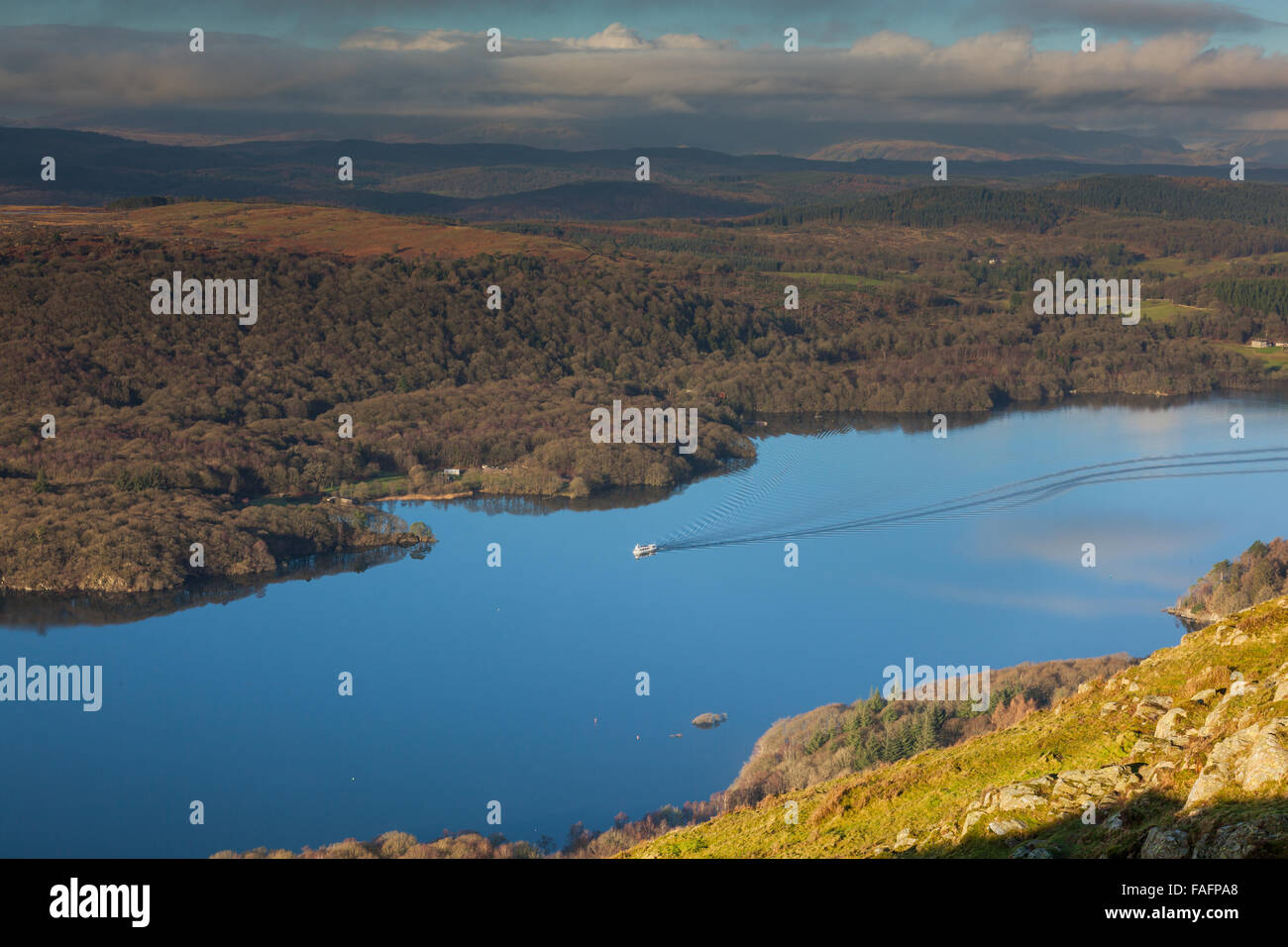 A pleasure boat cruises along Windermere, as seen from Gummer's How