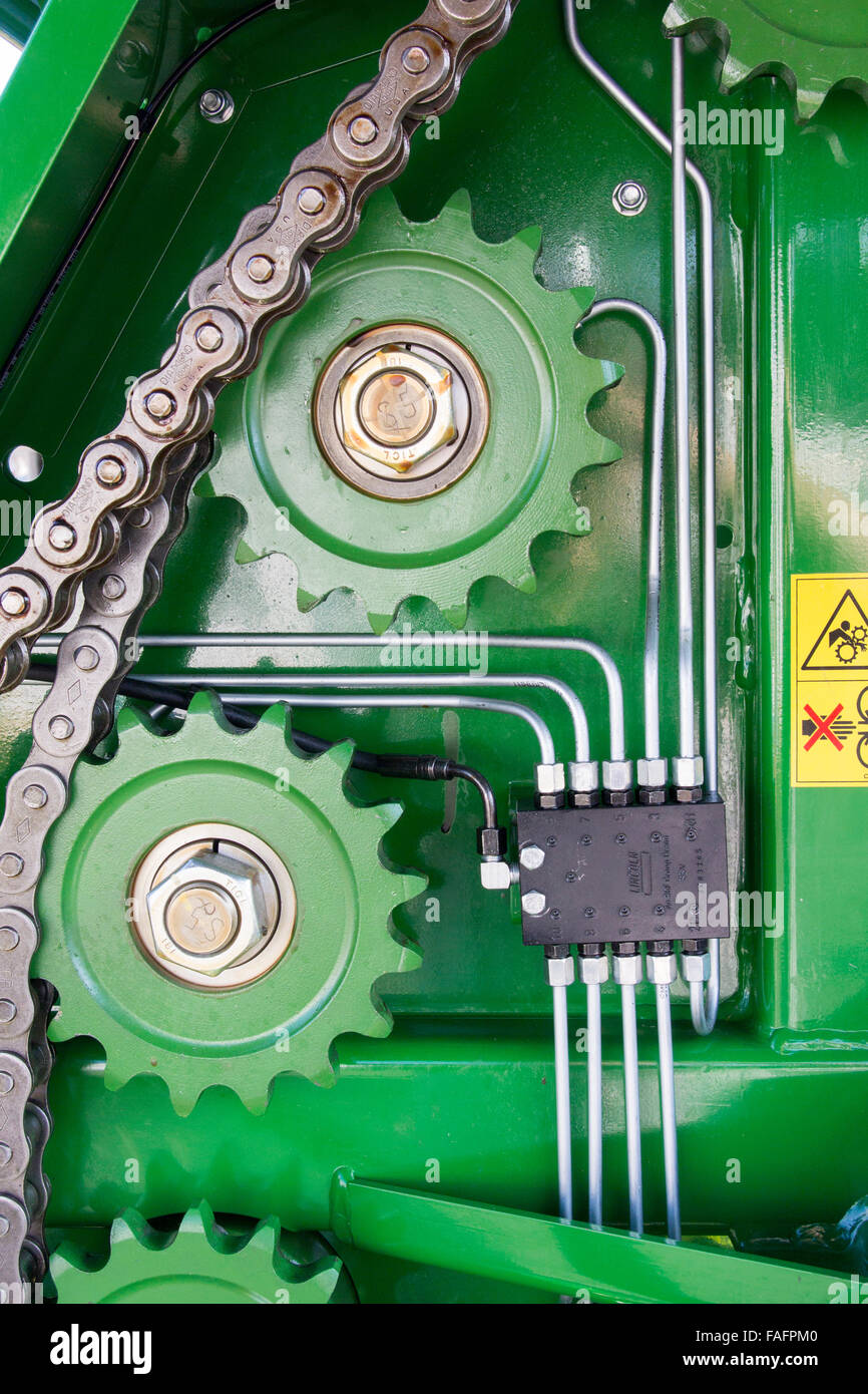 Internal workings of a big baler, showing cogs and chains. Stock Photo