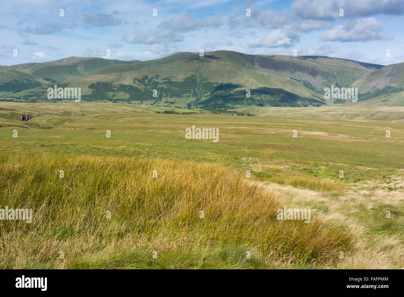 Typical peat moorland on Baugh Fell, looking towards the Howgill Fells, Cumbria, UK Stock Photo