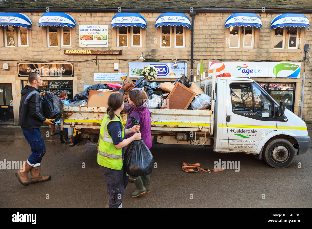 Hebden Bridge, UK. 29th Dec, 2015. Contents of a shop being cleared in Hebden Bridge two days after the Boxing Day floods Credit:  Graham Hardy/Alamy Live Newski Stock Photo