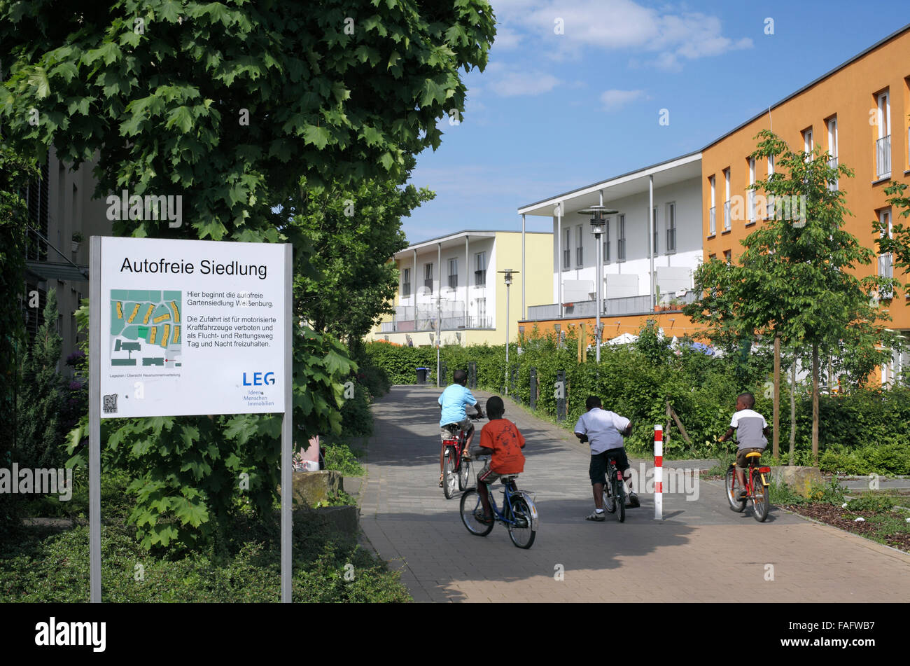 One of the entrances to the car-free settlement of Gartensiedlung Weissenburg, Muenster, Germany. (With map of estate layout.) Stock Photo