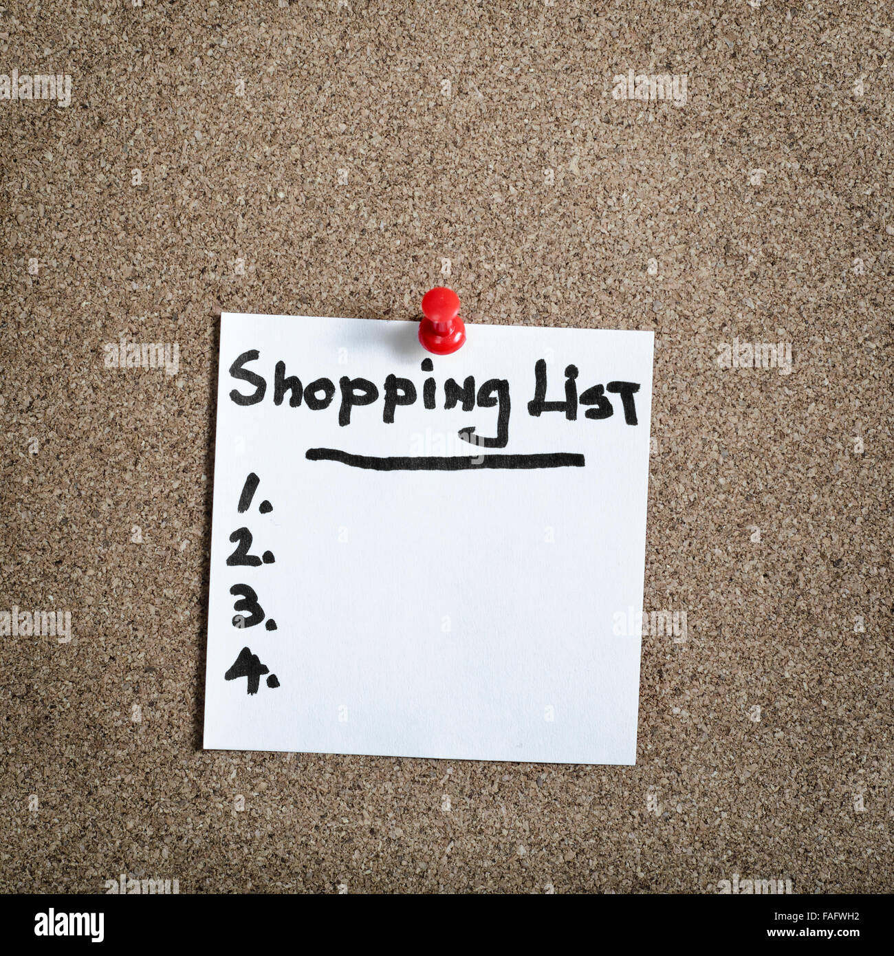 Reminder sticky note on cork board with SHOPPING LIST text Stock Photo